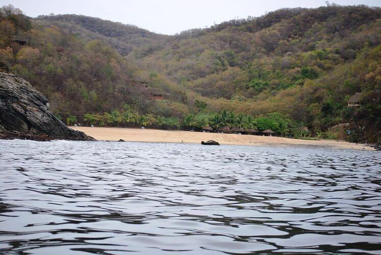 An image taken from aboard a boat of Playa Boquilla. A quiet beach on the Oaxacan coast