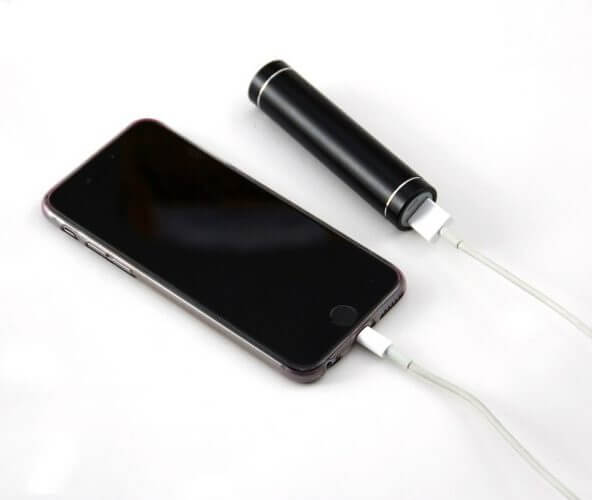 A picture of a phone connected to one of the best external batteries.