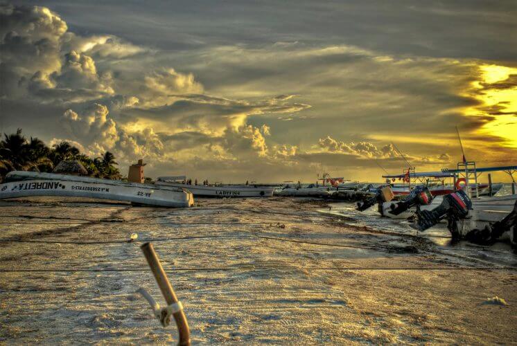 A stunning photograph of a serene sunset at a beach in Holbox
