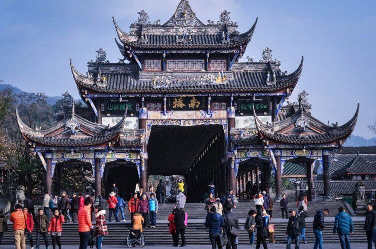 A picture of people in front of a temple