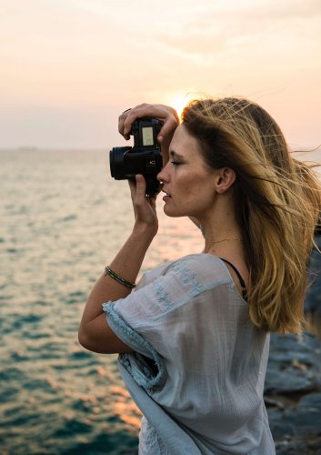 A photographer on a beach