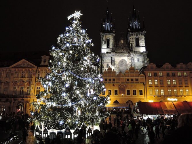 The christmas tree in the main square in prague is shown here