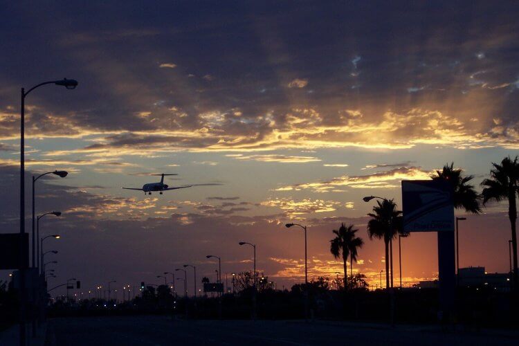 An image of a plane landing at LAX