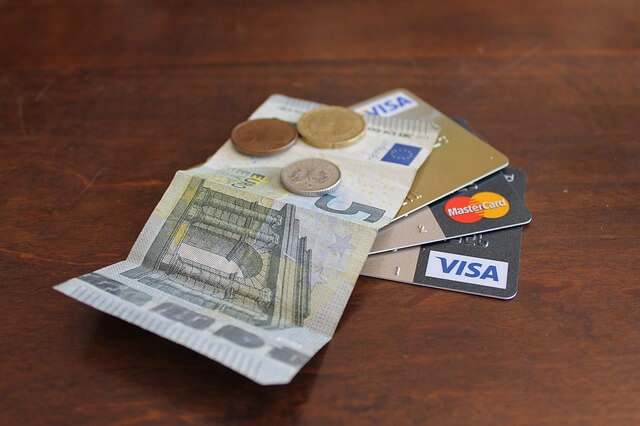 A picture of credit cards & cash