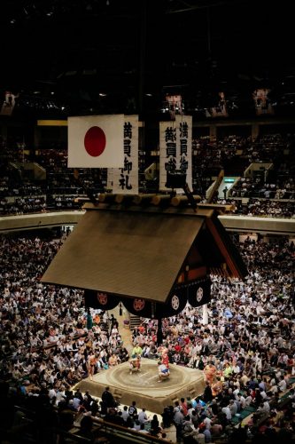 Sumo wrestling inside a stadium