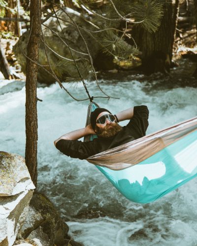 Picture of a man sleeping on a hammock