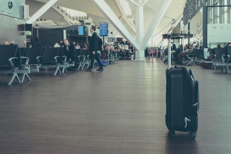 Unattended black suitcase in airport