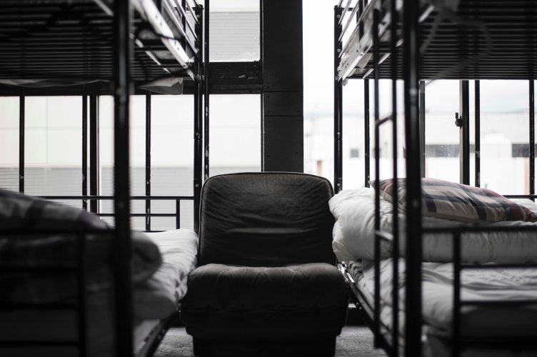Black and white bunkbeds in a hostel